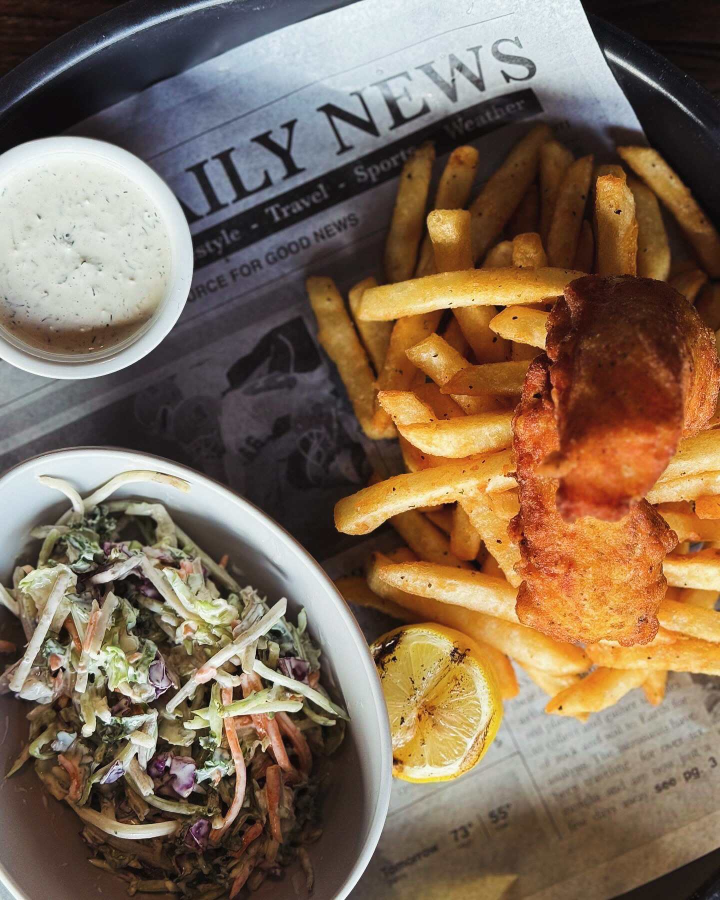 Battered cod with hand cut fries, cole slaw and tarter sauce at Whiskey & Water