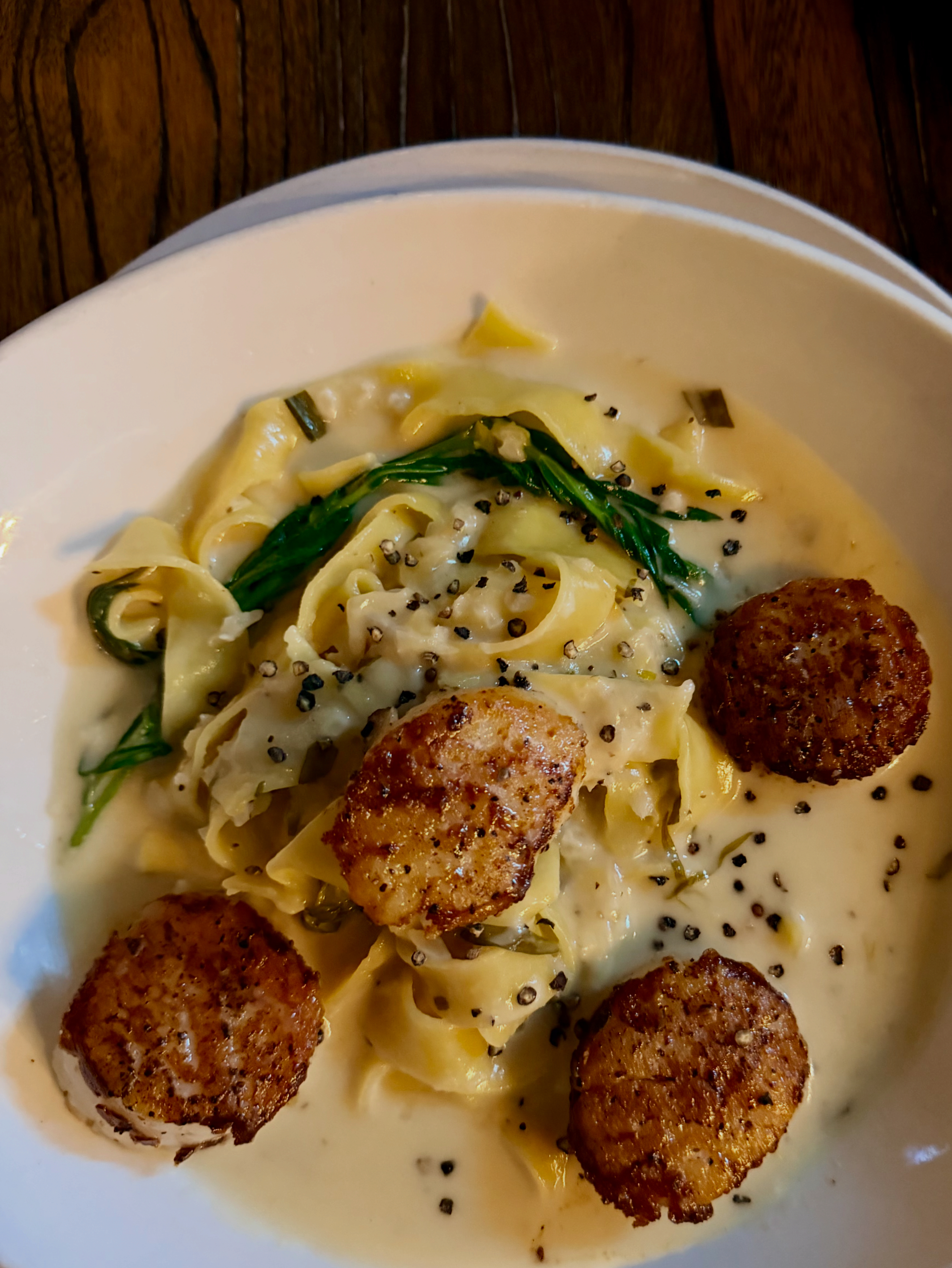 Seared scallops over pappardelle in a lemon cream sauce at Whiskey & Water, Blue Ridge, Georgia